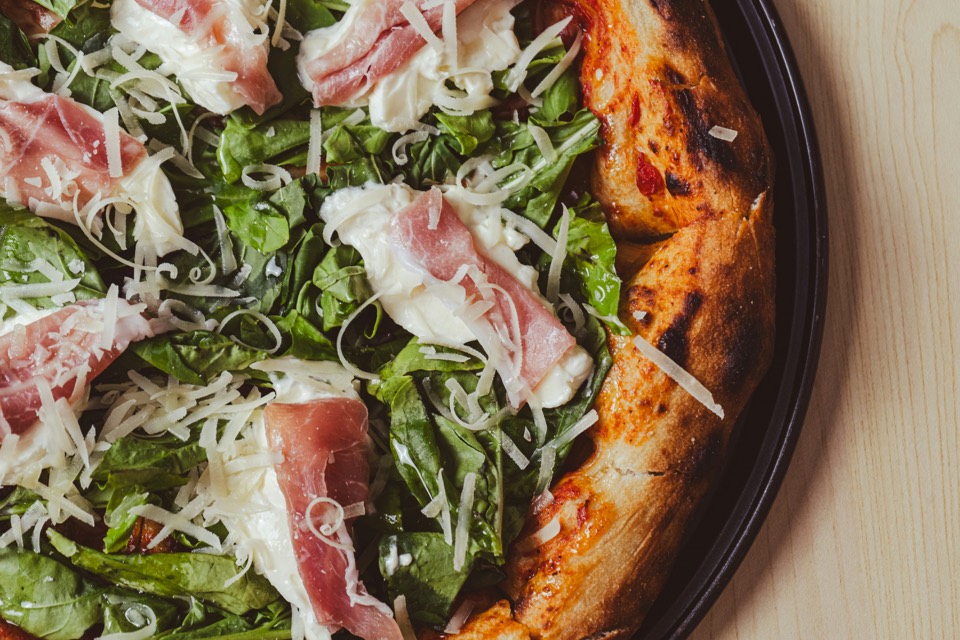 Prosciutto and rocket pizza with shaved parmesan